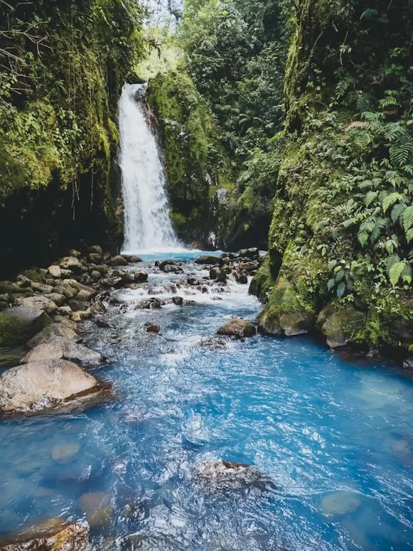 Turquoise Blue Falls waterfall in Bajos del Toro, Costa Rica