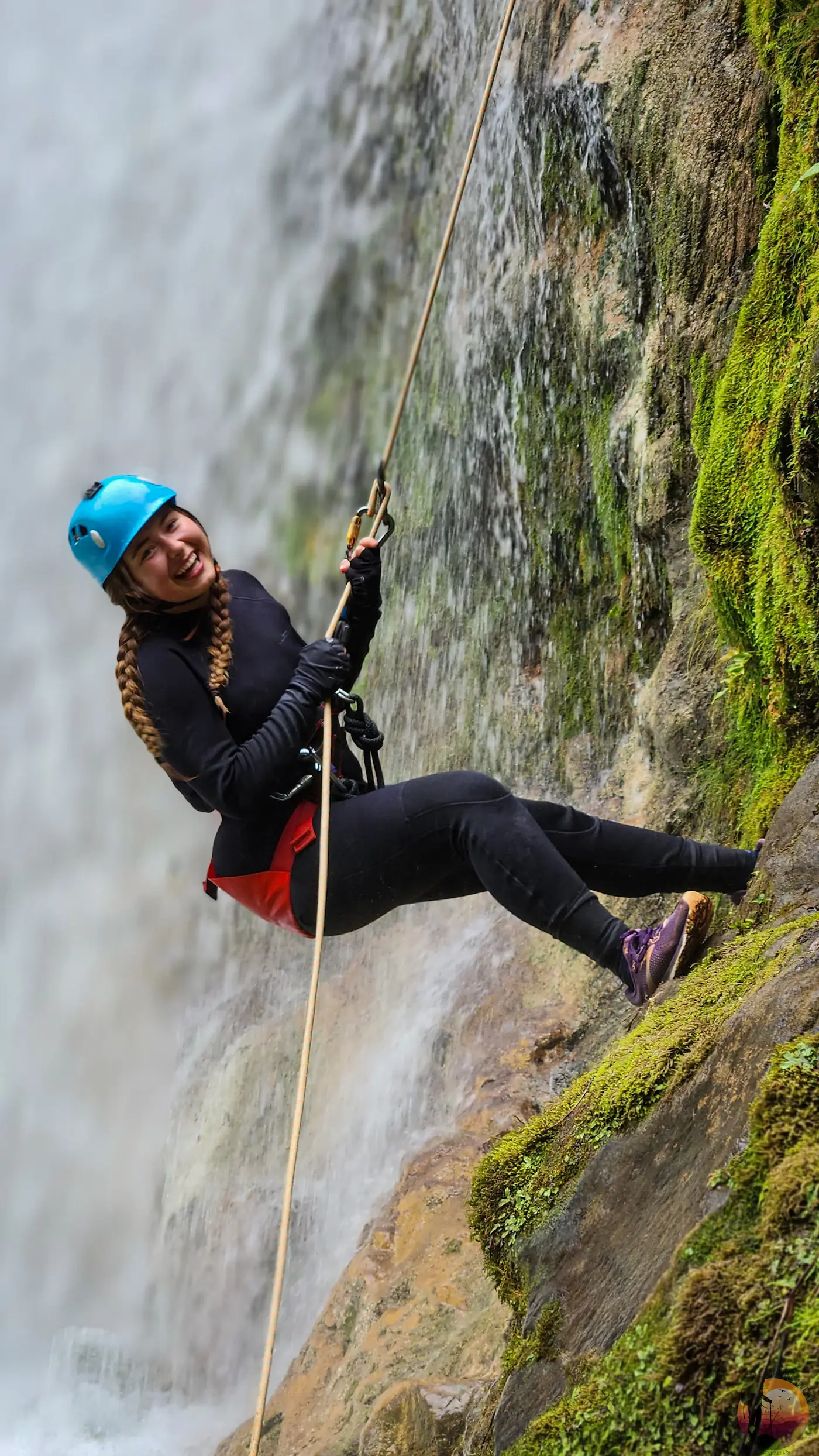 Canyoning rappel down a waterfall in Costa Rica