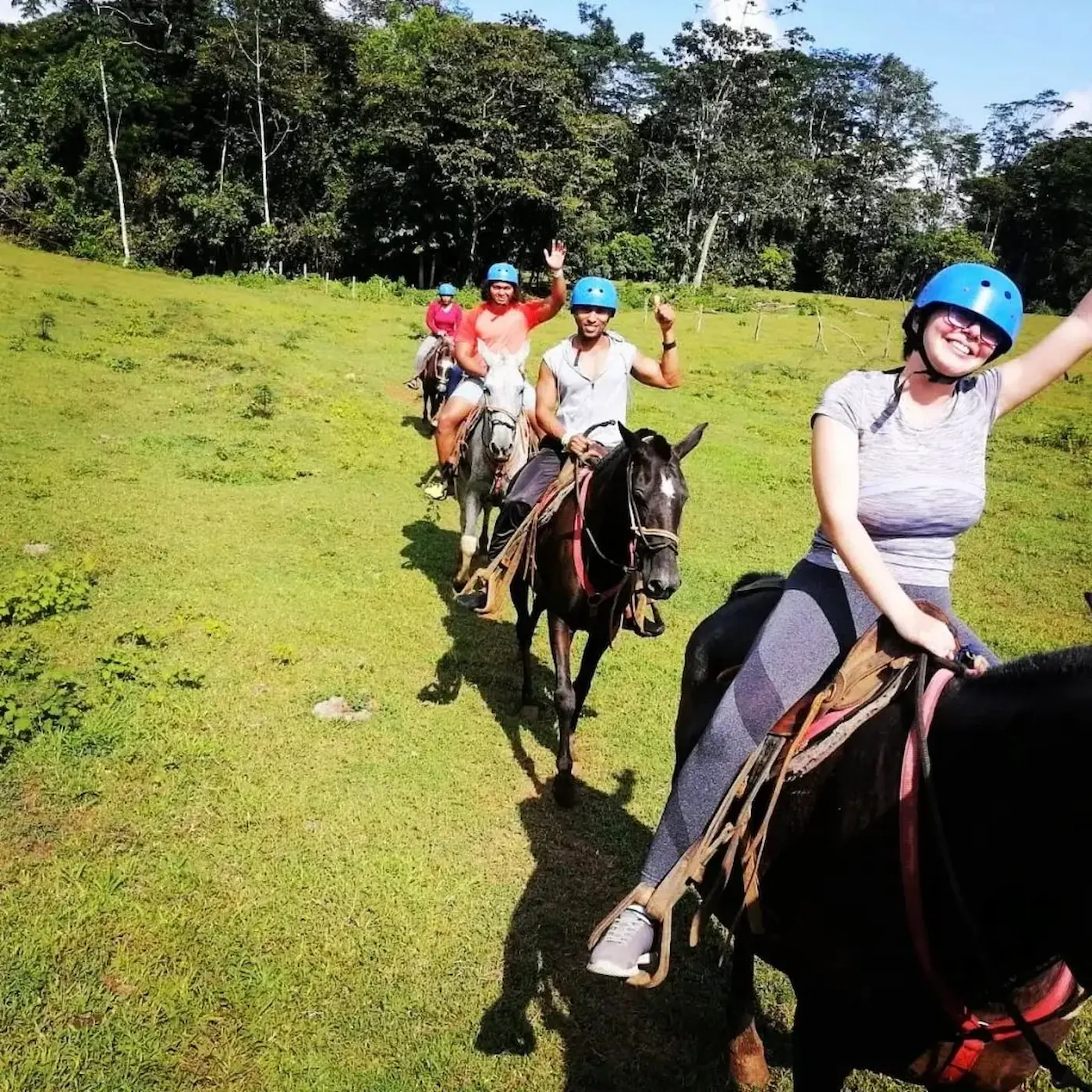 Horseback riding through pastures in Sarapiquí